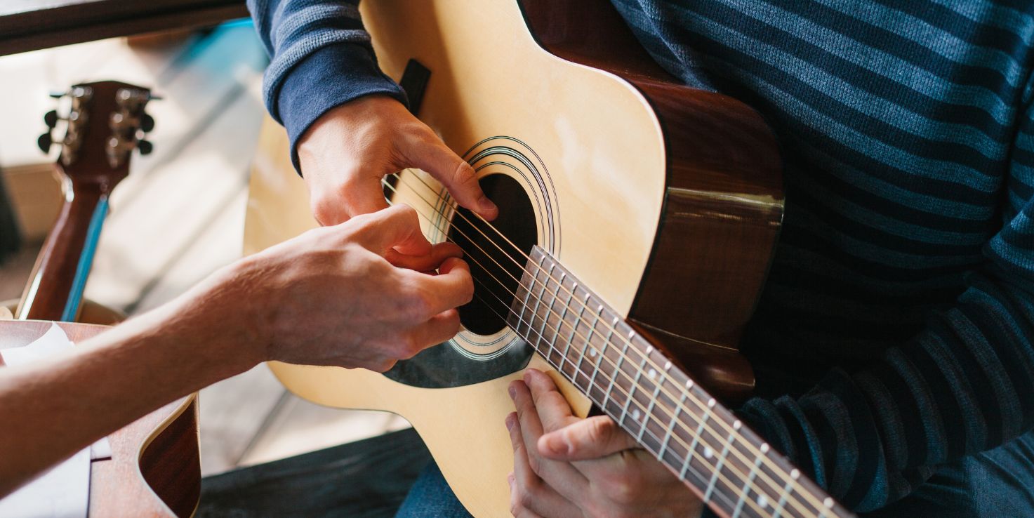 Featured image for “Two local teens receive 10 free guitar lessons from U-Rock Music School”